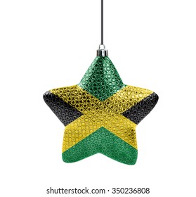 A glossy christmas star in the national colors of Jamaica isolated on a white background.