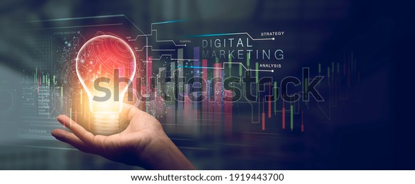 The\
glow light Data digital marketing graph with light bulb in dark\
background. 3D illustration in Technology\
concepts.