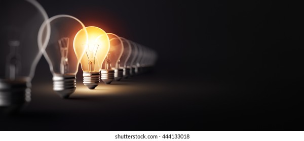 Glowing light bulb on dark background - 3D Rendering
