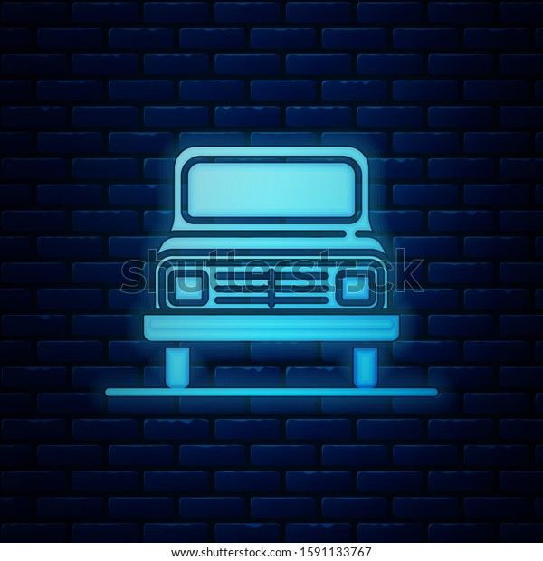 Glowing neon Car icon isolated on brick wall background.\
Front view.  