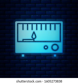 Glowing neon Electrical measuring instruments icon isolated on brick wall background. Analog devices. Electrical appliances.  