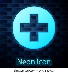 Glowing Neon Medical Cross In Circle Icon Isolated On Brick Wall Background. First Aid Medical Symbol