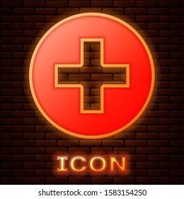 Glowing Neon Medical Cross In Circle Icon Isolated On Brick Wall Background. First Aid Medical Symbol.  