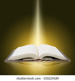 glowing  open  book with bright lights and colors - Shutterstock ID 150224189