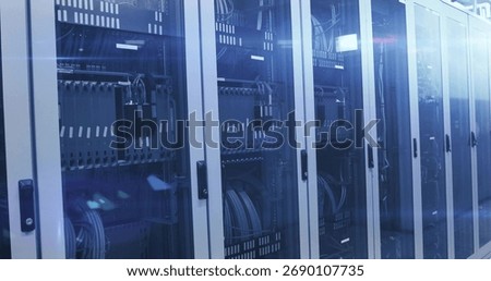 Glowing server rack row showcasing network switches, cables in data center, with LED status lights. Data center, technology, infrastructure, network, cybersecurity, industrial, organization