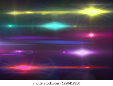 Glowing yellow, blue and pink spots of light and light trails on black background. light and colour concept digitally generated image.