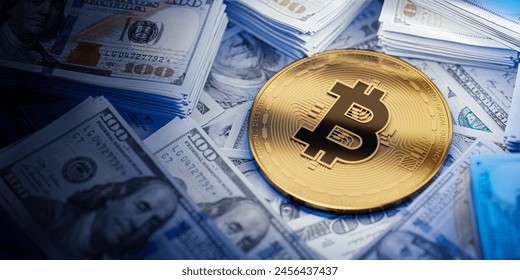 A gold Bitcoin token rests on piles of U.S. dollar bills, highlighting the intersection of cryptocurrency and traditional currency.