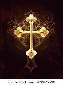 Gold Filigree Cross Worn On A Brown Dark Background.