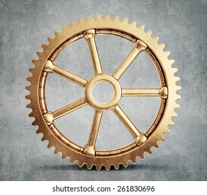 Gold Gear Isolated On A Grey Background