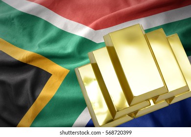 Gold Reserves. Shining Golden Bullions On The South Africa Flag Background