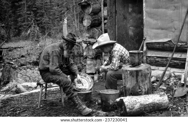 The Gold Rush, miners with gold in a pan,\
photograph by F,W,\
Byerly.