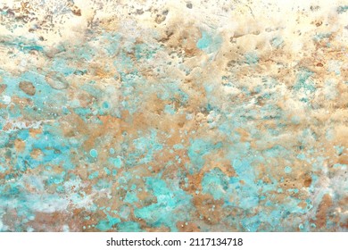 Gold and verdigris in a textured background