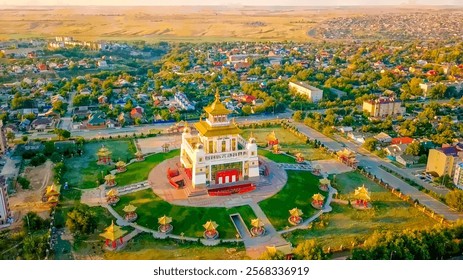 The golden abode of Buddha Shakyamuni at sunrise is the largest Buddhist temple in the Republic of Kalmykia, one of the largest Buddhist temples in Europe. Watercolor illustration. Elista, Russia