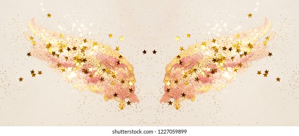 Golden Glitter And Glittering Stars On Abstract Pink Watercolor Wings In Vintage Nostalgic Colors.