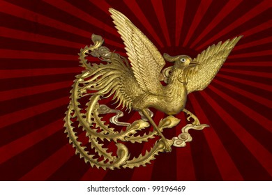 golden phoenix on sun graphic background