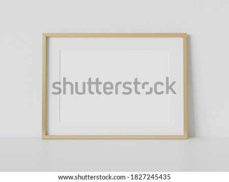 Golden rectangular frame leaning on white floor in interior mockup. Template of a picture framed on a wall 3D rendering