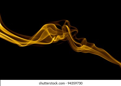 Golden Smoke Isolated On Black Background