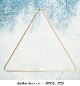 Golden Triangle Frame On A Leafy Shadow Background