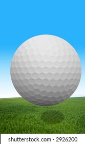 A Golf Ball Flying Over Grass.