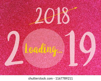 Goodbye 2018 Hello 2019, loading New Year words on Pink glitter texture Christmas abstract background.