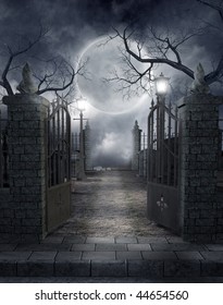Gothic Cemetery Gate With A Lantern And Dead Trees