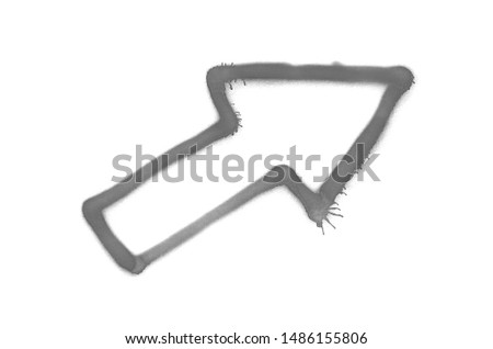 Graffiti diagonal arrow sprayed on white isolated background. Symbol painted in street art tag style in grey color