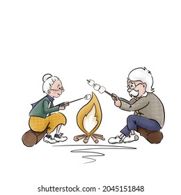Grandmother   grandfather roasting marshmallows the fire  Weekends in the forest  Outdoor activities  Happy grandparents  World senior citizen’s day  Active lifestyle
