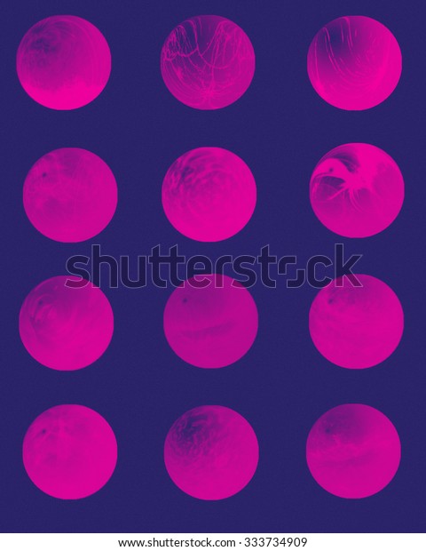 Graphic orbs or planets on dark texture background in\
purple. 