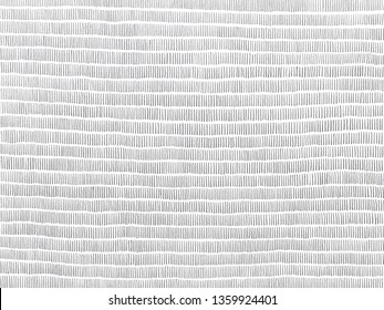 A gray scale texture background hand drawn using pencil. Closely spaced vertical stripes form horizontal stripes in the bigger picture.  