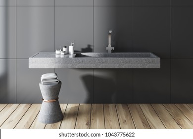 Gray Wall Bathroom Interior With A Long Gray Sink And A Chair With Towels. A Front View. 3d Rendering