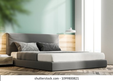 Green bedroom interior with a wooden floor and a king size bed. A side view and a close up. 3d rendering mock up - Shutterstock ID 1099800821