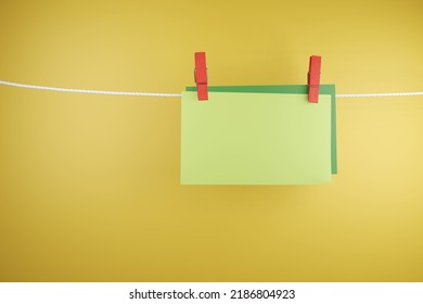 Green Blank Papers Held On A White String By Red Clothes Peg. 3D Illustration