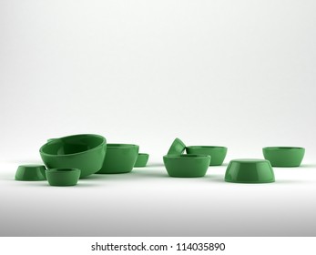 green bowls in studio setting - composition on white background