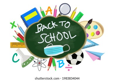 Green Chalk Board With Wording Back To School And Colorful Classroom Or Study Accessories To Welcome Back For New Semester With Face Mask To Protect From Coronavirus Or COVID 19