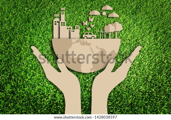 Green city. Paper art style of eco on green grass\
background. Save the\
earth.