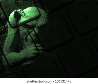 Green Gargoyle Figure Overlaid Over Computer Keyboard