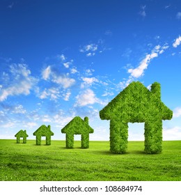 Green Grass  House Symbol Against Blue Sky