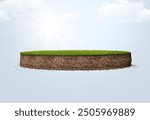 Green grass surface and soil with floating slice of land. Soil texture and flying land grass texture. 3d rendered, Floating in air with clouds and manipulation.