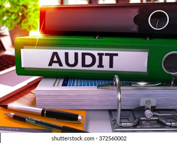 Green Office Folder with Inscription Audit on Office Desktop with Office Supplies and Modern Laptop. Audit Business Concept on Blurred Background. Audit - Toned Image. 3D - Powered by Shutterstock