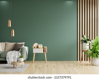 Green sofa with table on green wall and wooden flooring.3d rendering