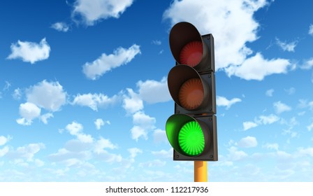 Green Traffic Lights Against Blue Sky Background