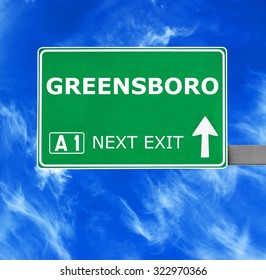 GREENSBORO road sign against clear blue sky