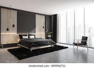 Grey Bedroom Interior With Panoramic City View, Wall Lining, Armchair, Creative Pendant Lights, Grey Carpet, Concrete Floor And Bed. Corner View. Concept Of Modern Design. 3d Rendering