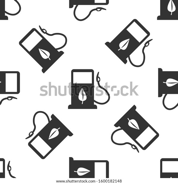 Grey Bio fuel concept with fueling nozzle and\
leaf icon isolated seamless pattern on white background. Gas\
station with leaves. Eco refueling.\
