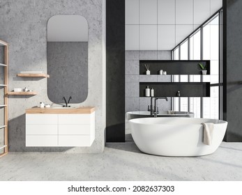 Grey Concrete Bathroom With Rounded Mirror And Two Little Shelves Over Floating Vanity. Mirror Wall Tiles In Bathtub Area With Niche Details. Concept Of Modern Interior Design. 3d Rendering