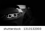Grey new generic stylish sport coupe car with laser led headlight on dark black background. 3D render 