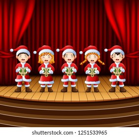 Group Of Children Singing Christmas Carols On The Stage