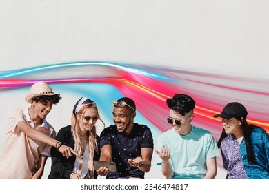 Group of five diverse friends enjoying time together, smiling and looking at a phone. Casual, cheerful, and diverse group having fun with social media. Teenagers diverse friends social media concept. - Powered by Shutterstock