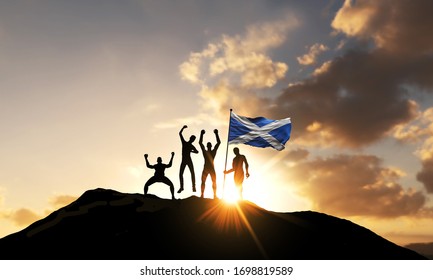 A Group Of People Celebrate On A Mountain Top With Scotland Flag. 3D Render