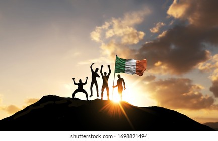 A Group Of People Celebrate On A Mountain Top With Ireland Flag. 3D Render